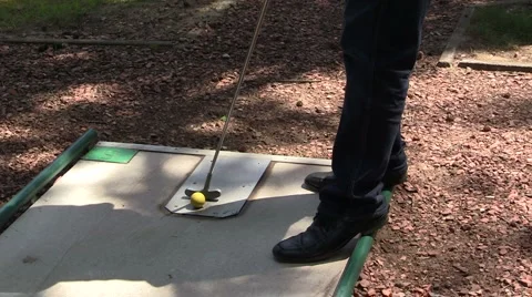 Man plays mini golf Stock Footage 6531484