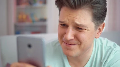 A man plays on a mobile phone Stock Footage 102186107