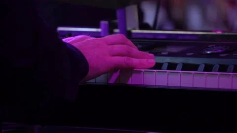 A man plays the piano Stock Footage 197369896