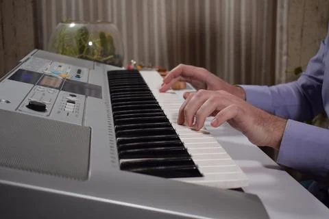 A man plays the piano Stock Photos
