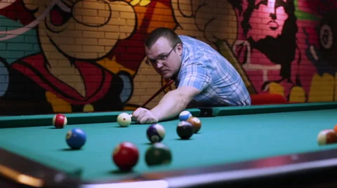 Man plays pool, man driving the ball in the hole Stock Footage 58627596