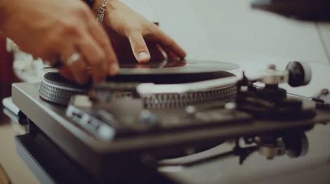 Man plays a record on his turntable Stock Footage 62640079