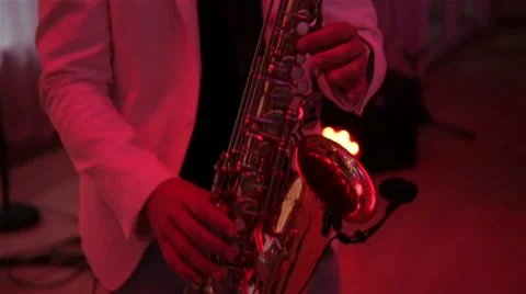 A man plays the saxophone Stock Footage 67421837