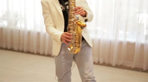 A man plays the saxophone Stock Footage 67473971