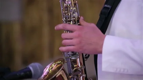 A man plays the saxophone Stock Footage 73392329