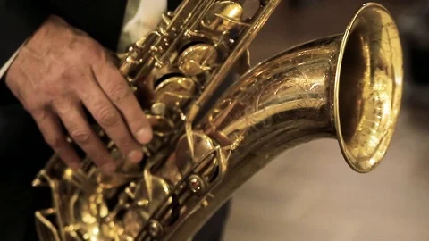 A man plays the saxophone. Stock Footage 119854564