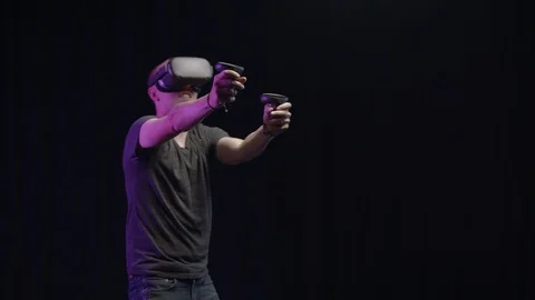 Man plays shooting game in Virtual Reality 스톡 동영상 118903628