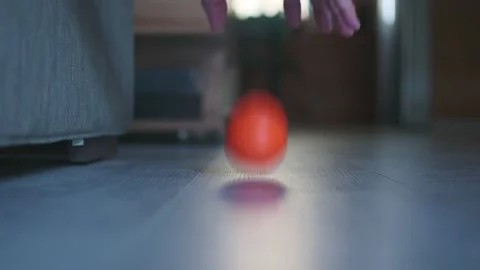 Man plays with a small orange ball. Stock Footage 315068473