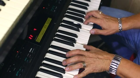 A man plays the synthesizer Stock Footage 115641460