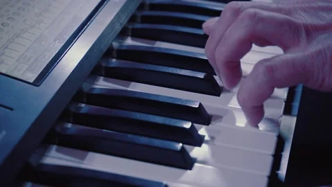 A man plays a synthesizer Stock Footage 130751048