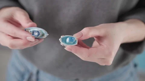 A man plays with two small boats making wave-like movements Stock Footage 143910296