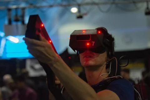 A man plays a video game using virtual reality glasses 写真素材