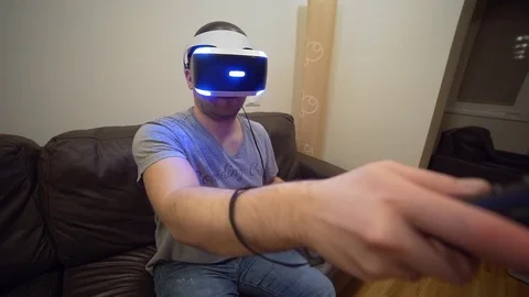 Man plays video game in VR system, virtual reality headset, 3d reality games Stock Footage 73325462