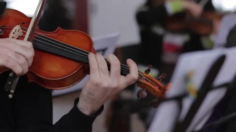 Man plays the violin front view. Video stock 73445772