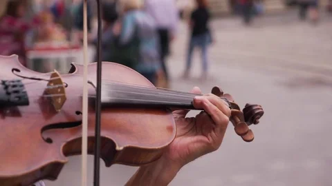 The man plays the violin on the street Stock Footage 79100852