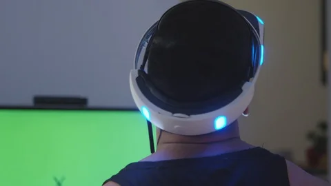 Man Plays Virtual Reality Game with Controller and Looks Around, Green Screen Stock Footage 108881029