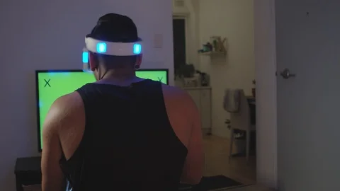 Man Plays Virtual Reality Video Game with Gun and Goggles, Green Screen Stock Footage 108880912