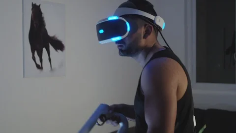 Man Plays Virtual Reality Video Game with Gun and Goggles in Living Room, Night Stock Footage 108881216