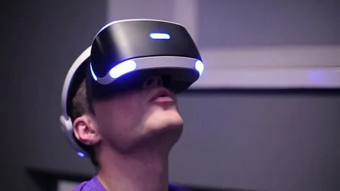 Man plays VR video game Stock Footage 75392044