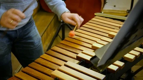 Man plays on xylophone Stock Footage 71544361