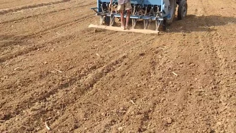 A man is ploughing the field with tractor. Stock Footage 143257971