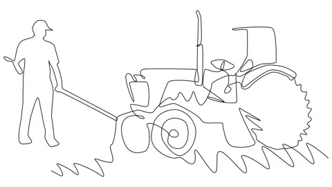Man plowing a field with a tractor during the day in a rural area Stock Footage 282147065