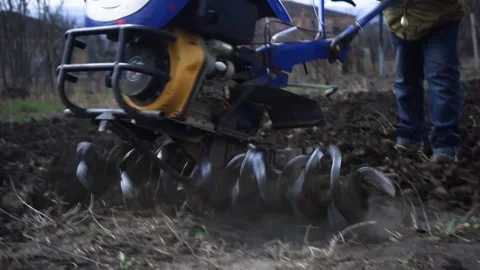 A man is plowing the land with a tractor Stock Footage 151595913