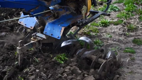 A man is plowing the land with a tractor Stock Footage 151595919