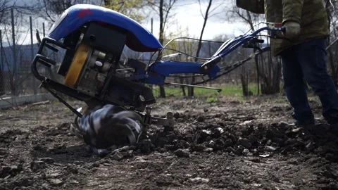 A man is plowing the land with a tractor Stock Footage 151595920