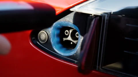 Man Plug Charger Connector in Electric Car Stock Footage 89153157