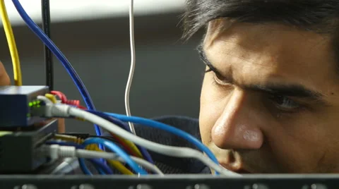 Man plugging in ethernet cable extreme close Видео 55274752