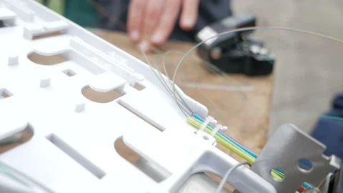 Man plugging in a fiber optic hub cable Stock Footage 126951568