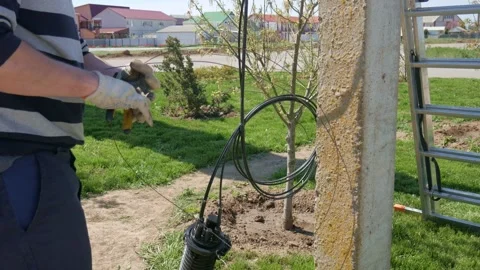 Man plugging in a fiber optic hub cable Stock Footage 148048325