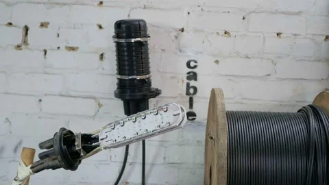 Man plugging in a fiber optic hub cable Stock Footage 150681730