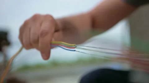 Man plugging in a fiber optic hub cable Stock Footage 156415662