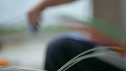 Man plugging in a fiber optic hub cable Stock Footage 156595615