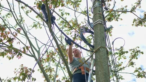 Man plugging in a fiber optic hub cable Stock Footage 156596169