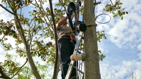 Man plugging in a fiber optic hub cable Stock Footage 156596345
