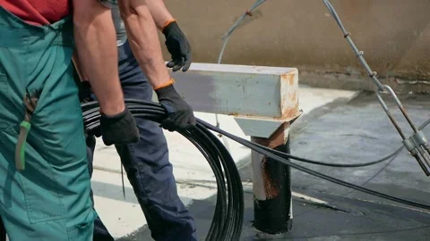 Man plugging in a fiber optic hub cable Stock Footage 156626702