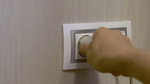 Man plugs a plug into the outlet Stock Footage 78420622
