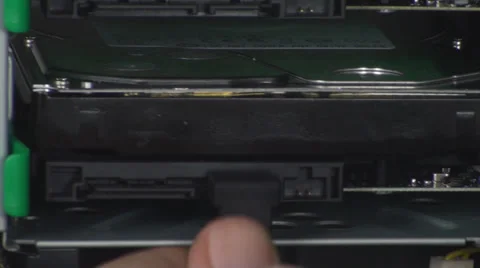 Man Plugs In A SATA Cable Into A Hard Disk Drive Stock Footage 36035324