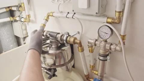 Man plumber repairs the plumbing in the kitchen Stock Footage 238993677