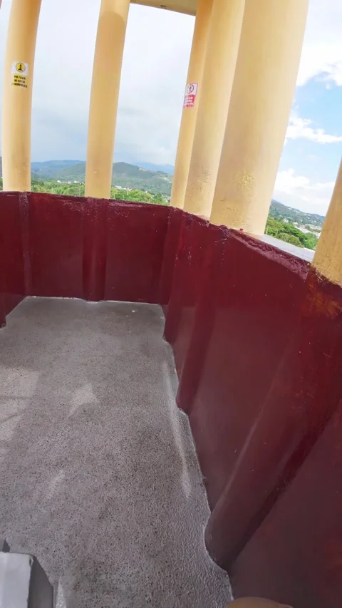 Man point of view arriving to top of tower for overlooking a leafy park, st.. 動画素材 338203916