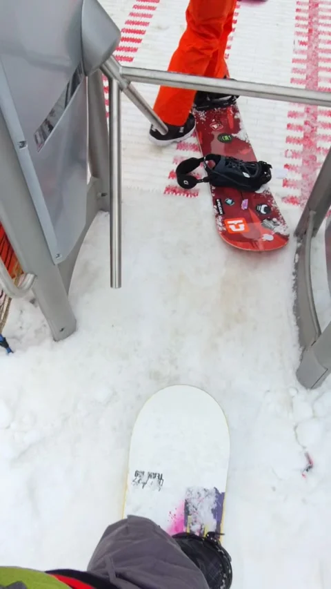 Man point of view passing ski pass gate lift chair Stock Footage 169221046