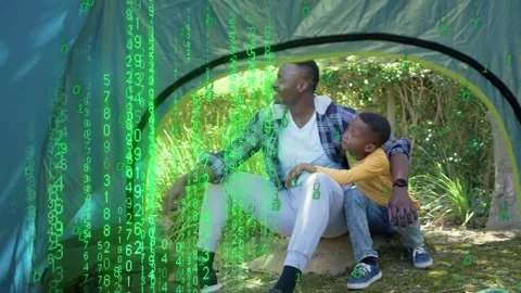 Man pointing, causing neon code falling over tent and child, camera pulling Stock Footage 333602793