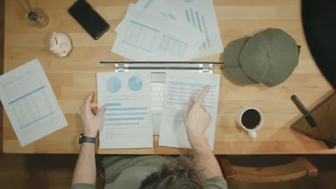 Man Pointing Comparing Financial Reports Data Analysis Desk Business Charts.. Stock Footage 344089239
