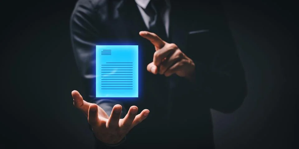 Man pointing to a digital blueprinted document floating above his palm, concept: Stock Photos