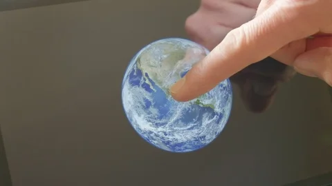 A man pointing at the earth on a screen Video stock 102948739