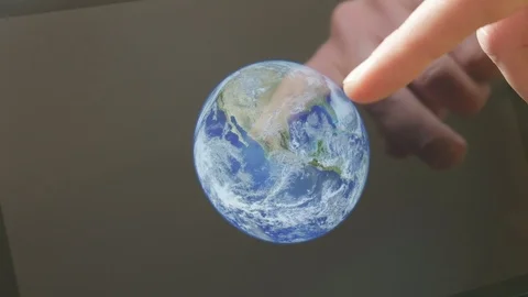 A man pointing at the earth on a screen Video stock 102949983