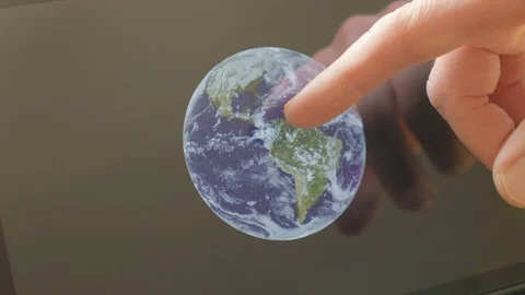 A man pointing at the earth on a screen Video stock 102951671